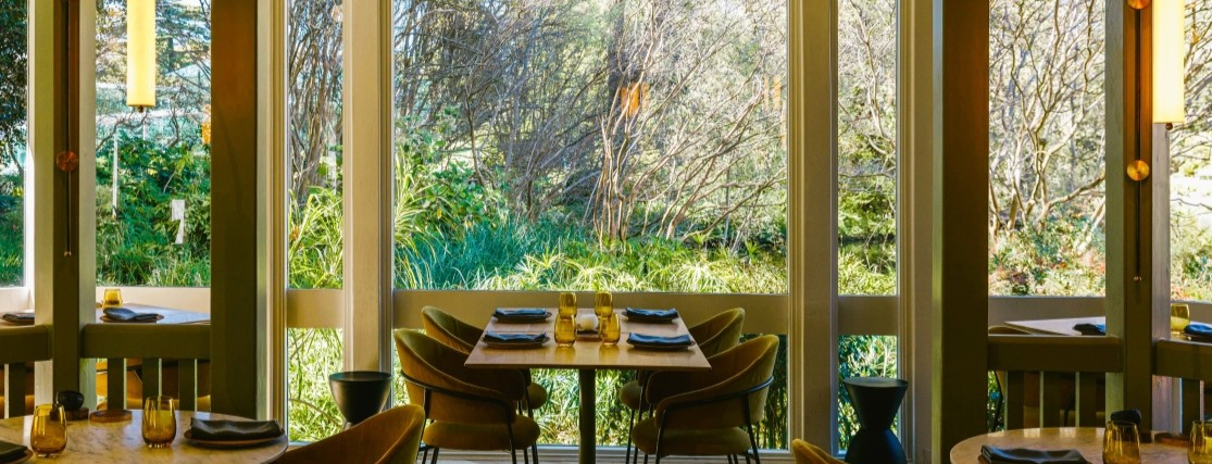 a dining table at a restaurant looking out to the Adelaide Botanic Gardens