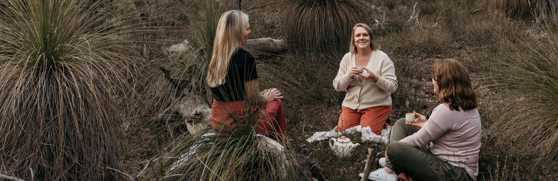 3 ladies sitting in the forest near Perth having cups of tea