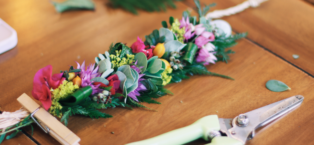 A group of people wearing traditional Hawaiian lei's that they have hand made