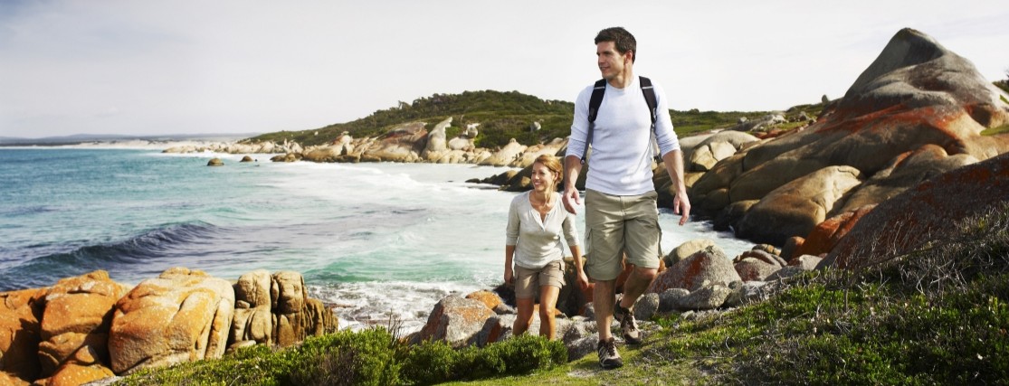 a couple hiking along the Bire of Fires track