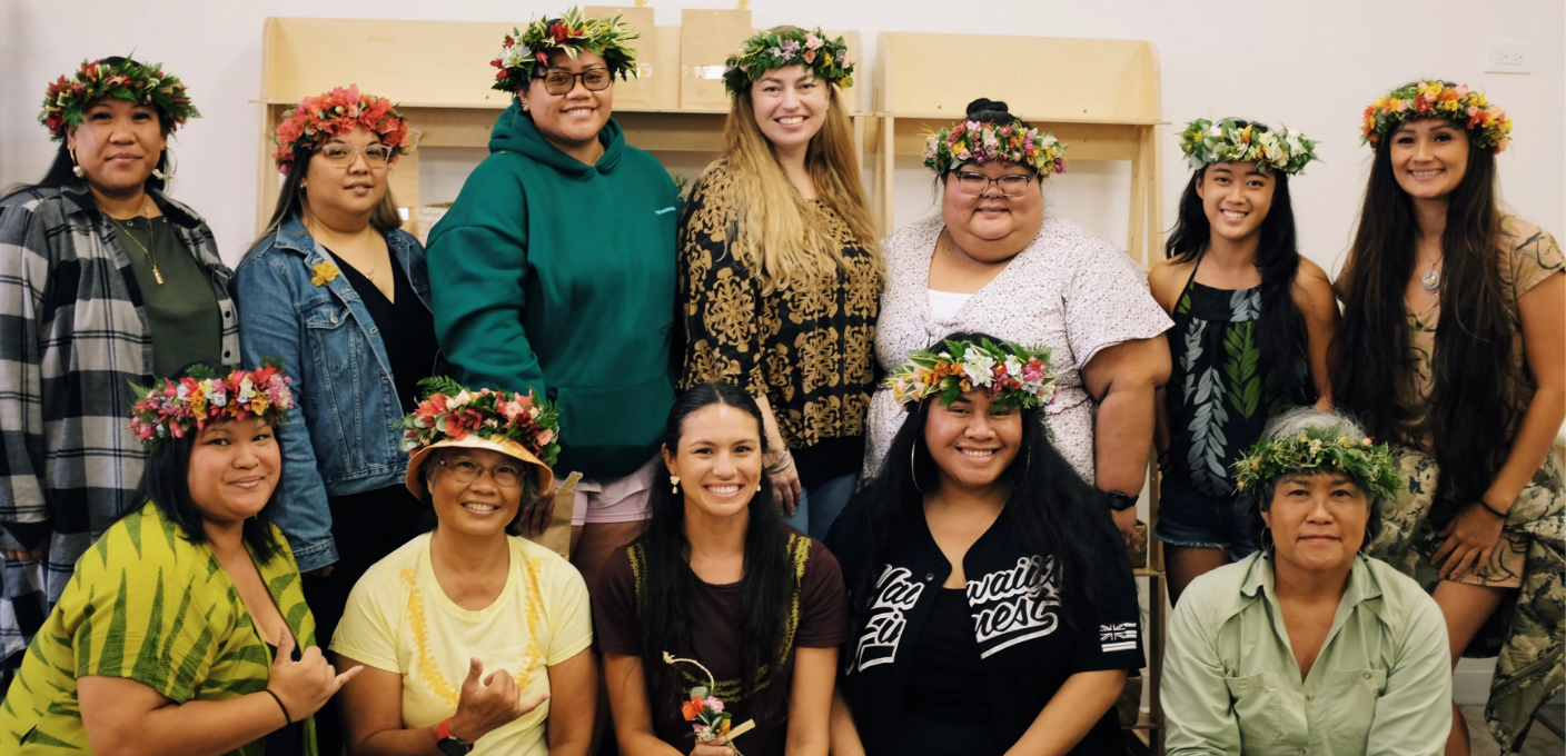 A group of people wearing handmade Hawaiian floral lei's
