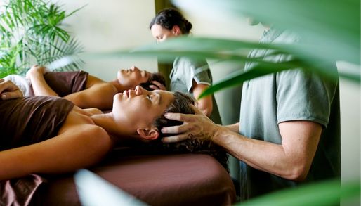 2 people having a facial in a tropical day spa