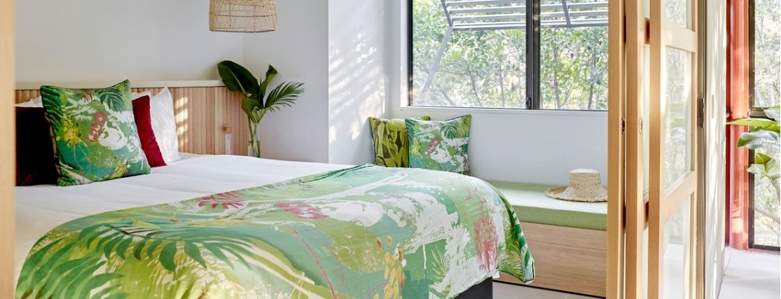 A room at crystalbrook byron with a tropical feel and outlook to the garden