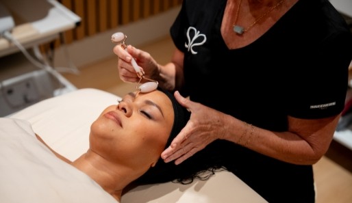 a lady relaxing in a day spa during a facial