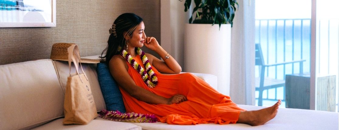 a lady relaxing in a hotel room at Alohilani resoirt