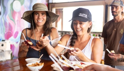 2 woman enjoying home made ice cream on a farm tour in Maui
